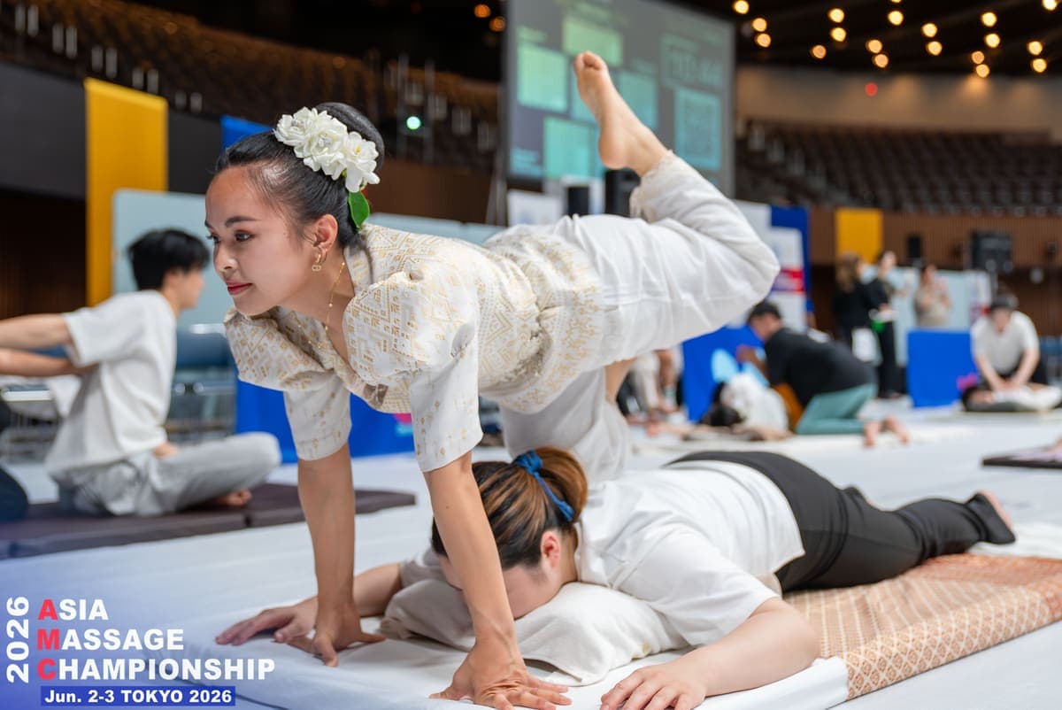 A competitor performing a Thai technique on the mat